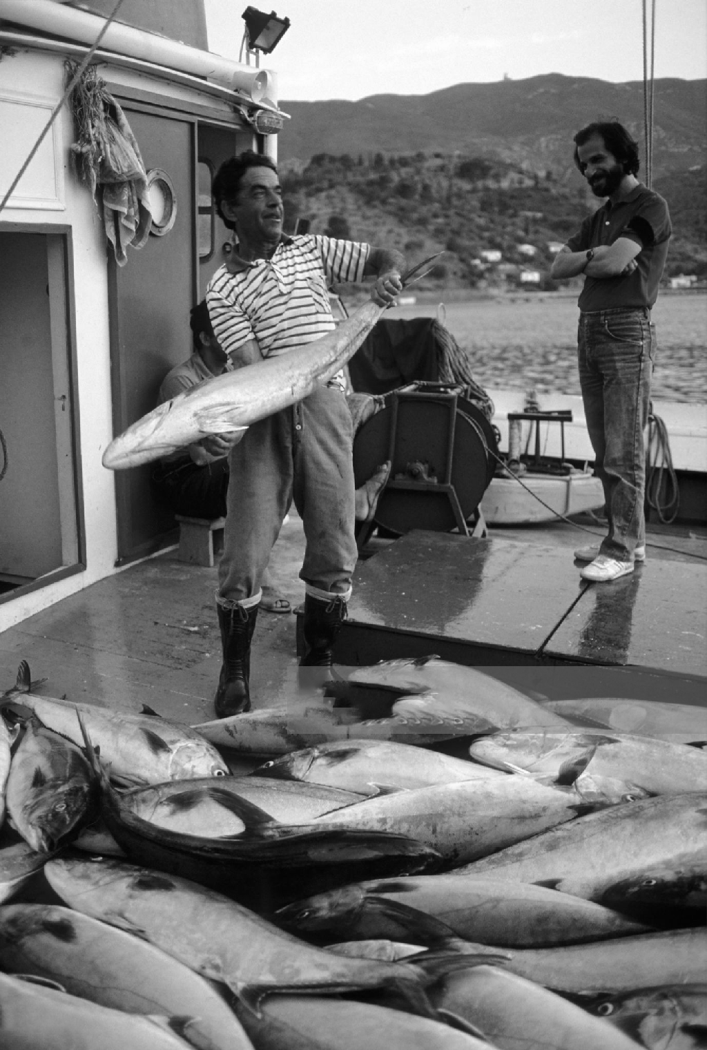 Poros fisherman Spyros with the fresh catch on a boat